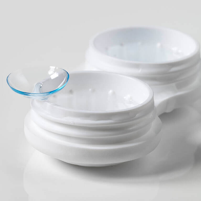 Close-up of contact lens and case